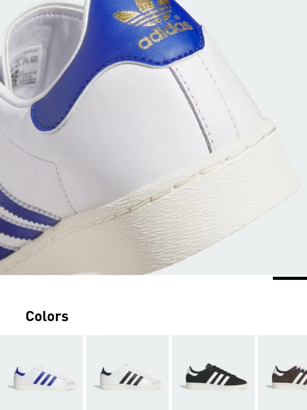 adidas White Sneakers with Blue Accents and Black Logo